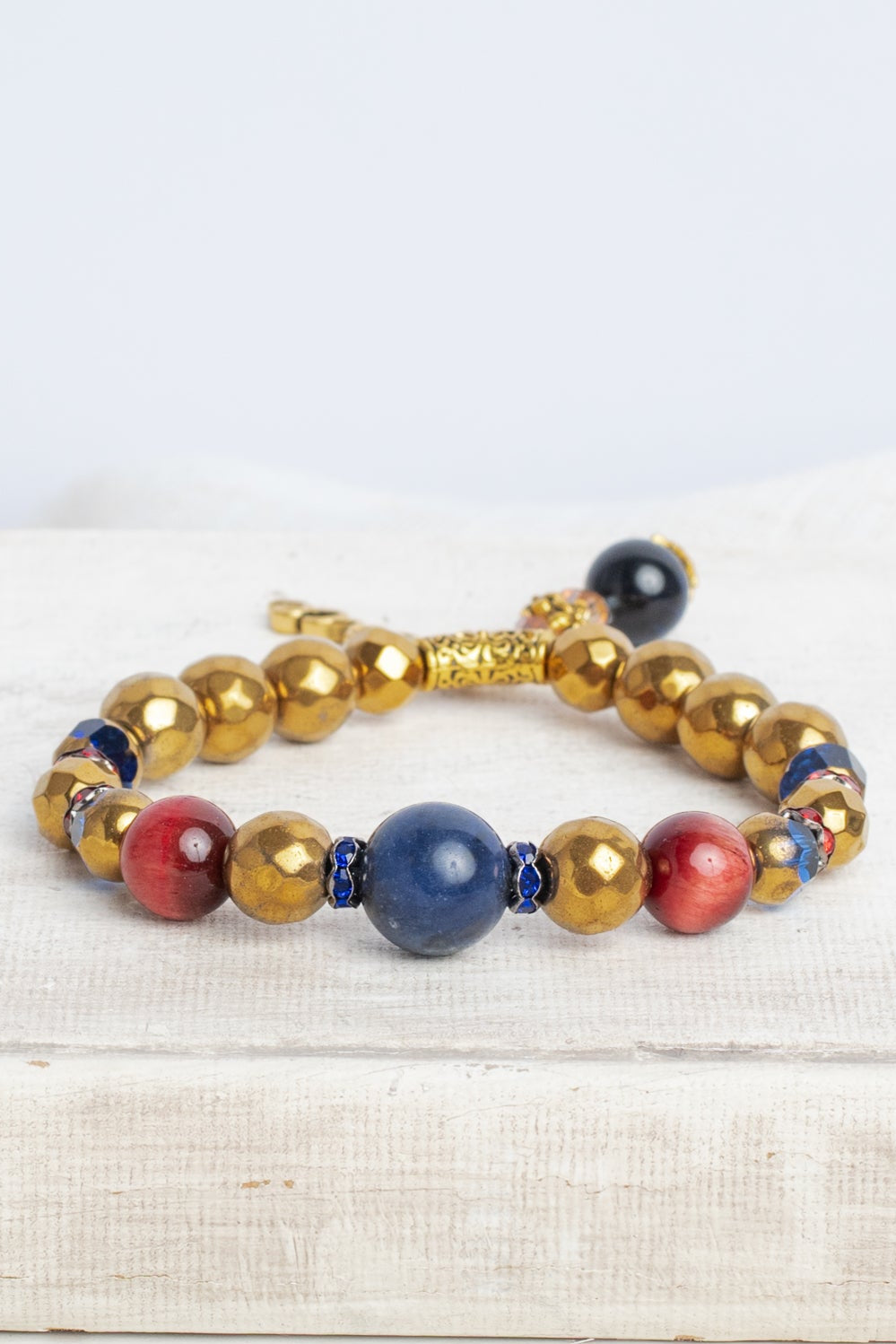 Royal Blue Lapis and Gold plated Hemitite Stone Stretch Bracelet with Gold PEACE Charm