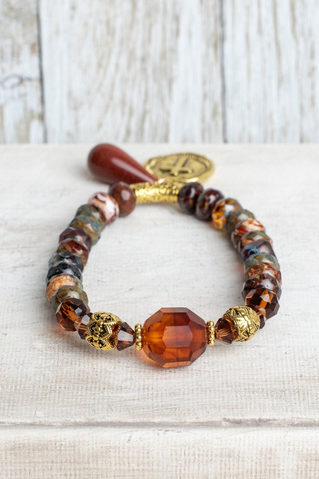 Warm Fall Multi Color Czech Fire Polished Beaded Stretch Bracelet with Gold Cross Charmm and Sandstone Drop