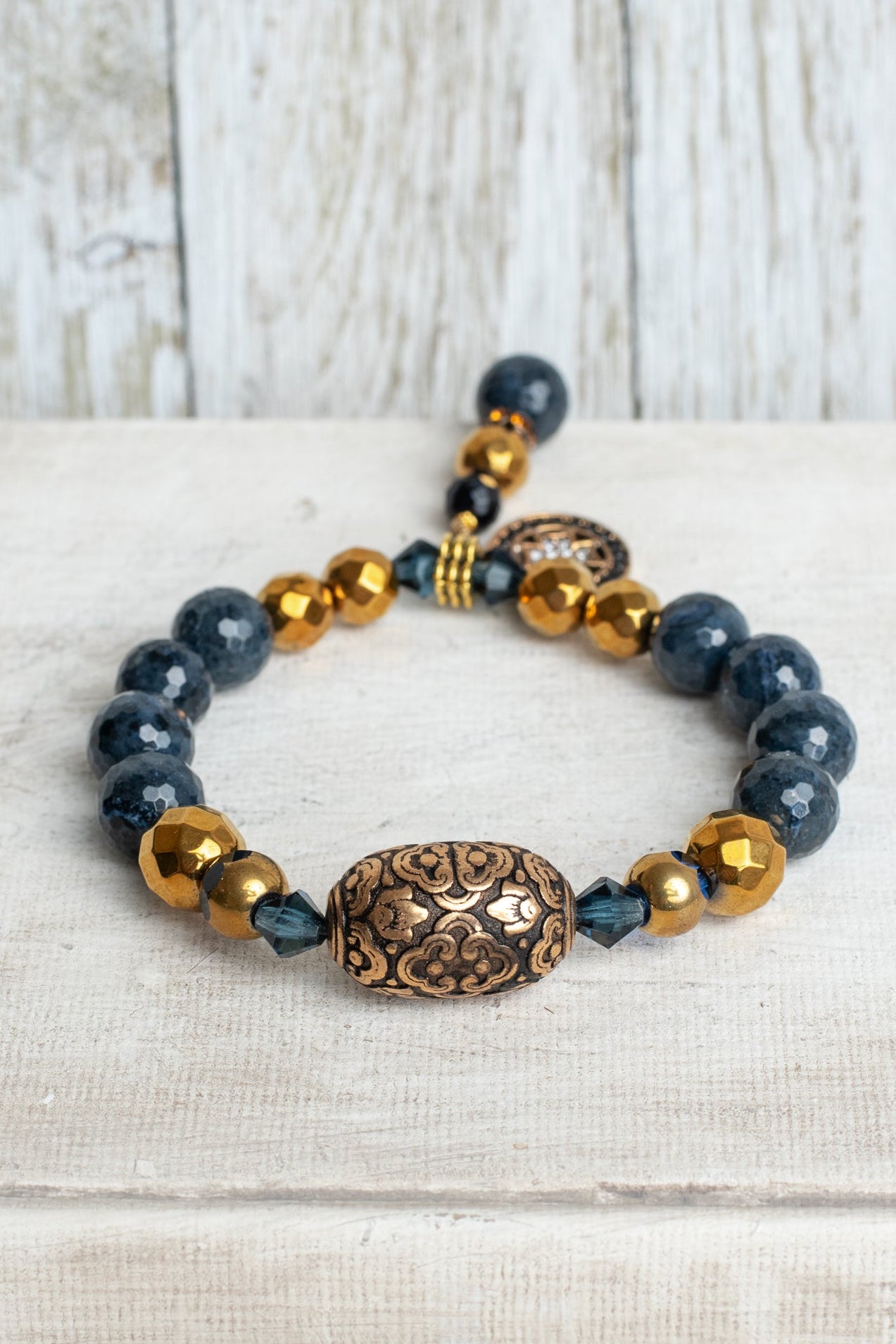 Faceted Dark Blue Sapphire and Dark Gold Hemitite Stone Beaded Stretch Bracelet with Sterling Silver Cross and Stone and Crystal Charm