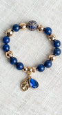 Royal Blue Lapis and Gold plated Hemitite Beaded Stretch Bracelet with Gold Plated Cross Charm and Crystal