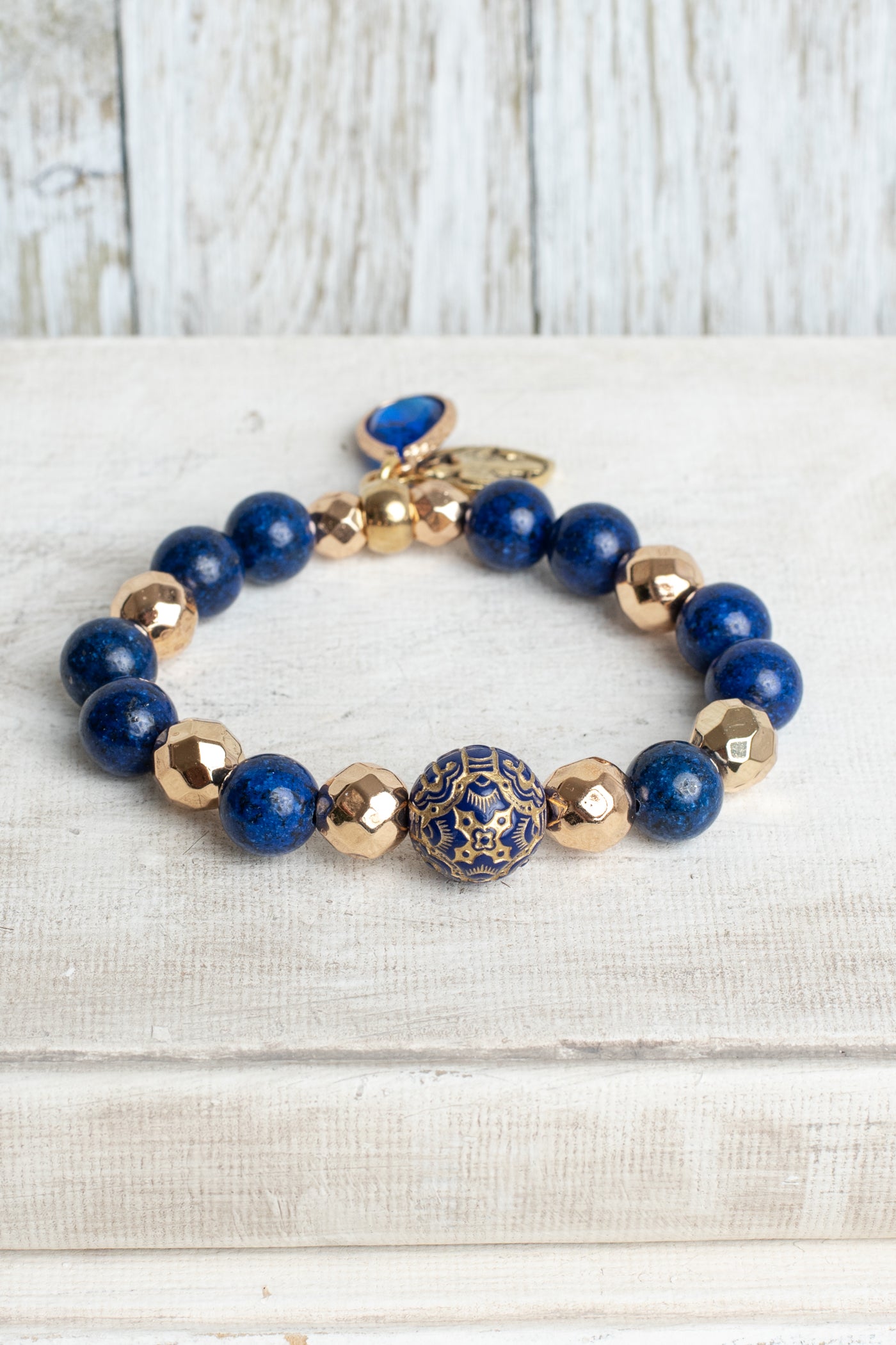 Royal Blue Lapis and Gold plated Hemitite Beaded Stretch Bracelet with Gold Plated Cross Charm and Crystal