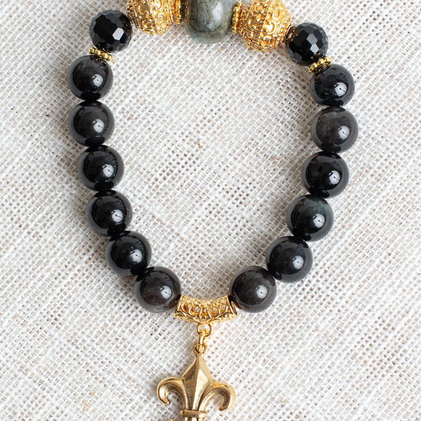 Gold Plated Beads and Fleur De Lis Charm on Obsidian and Labradorite Stretch Bracelet