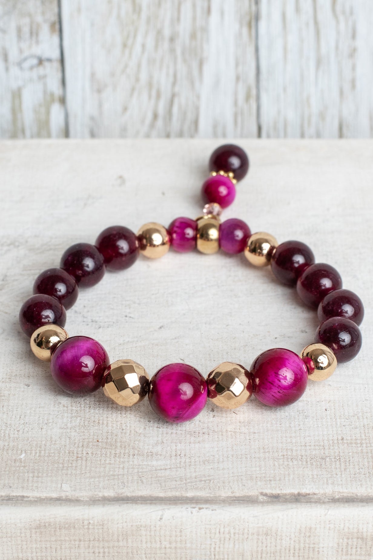 Magenta Tiger's Eye Jasper and Garnet Stone Beads with Gold Plated Elements on a Stretch Bracelet with Matching Beaded Charm
