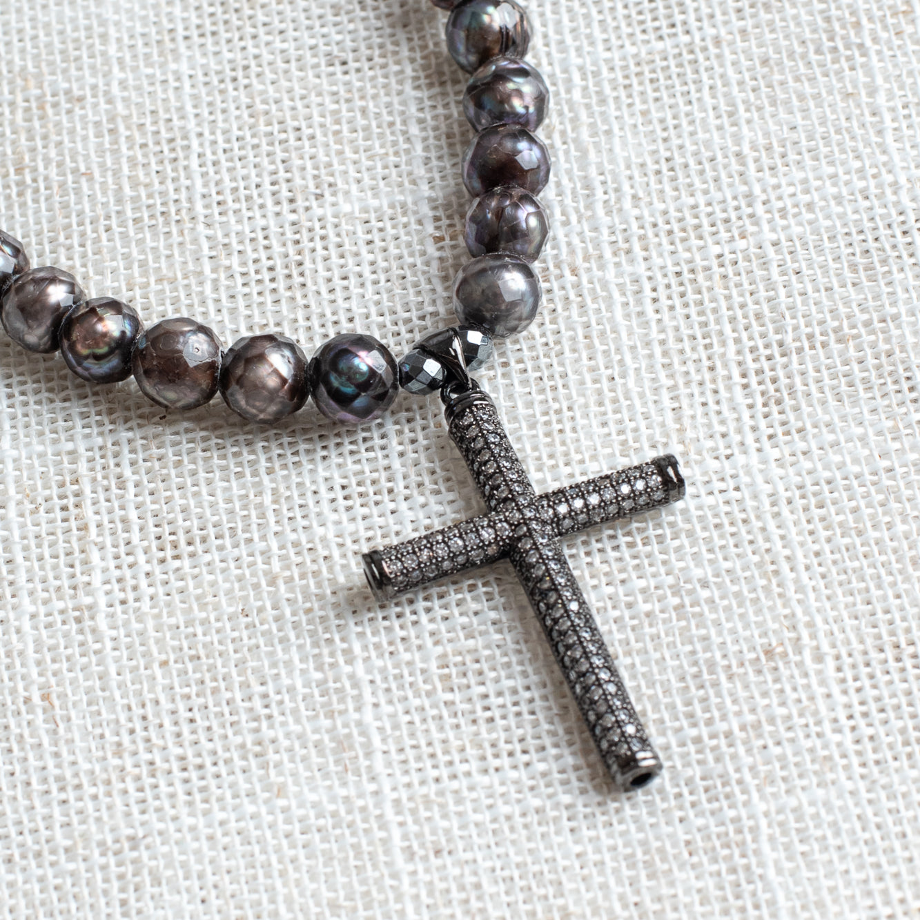Sterling Silver Micro Pave Cross Pendant on a Faceted Peacock Pearl Strand