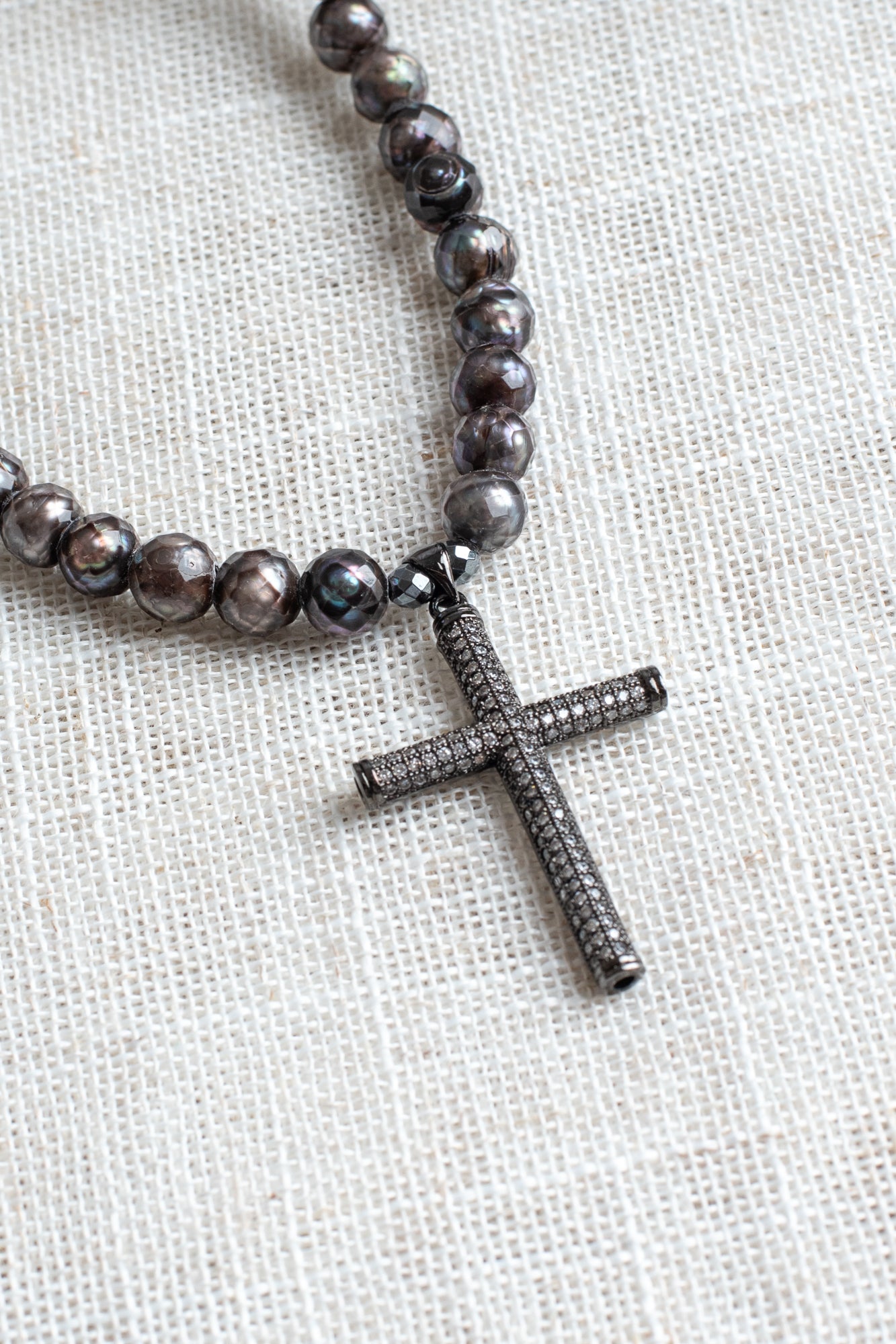 Gunmetal Sterling Silver Micro Pave Modern Cross Pendant on a Faceted Peacock Pearl Strand