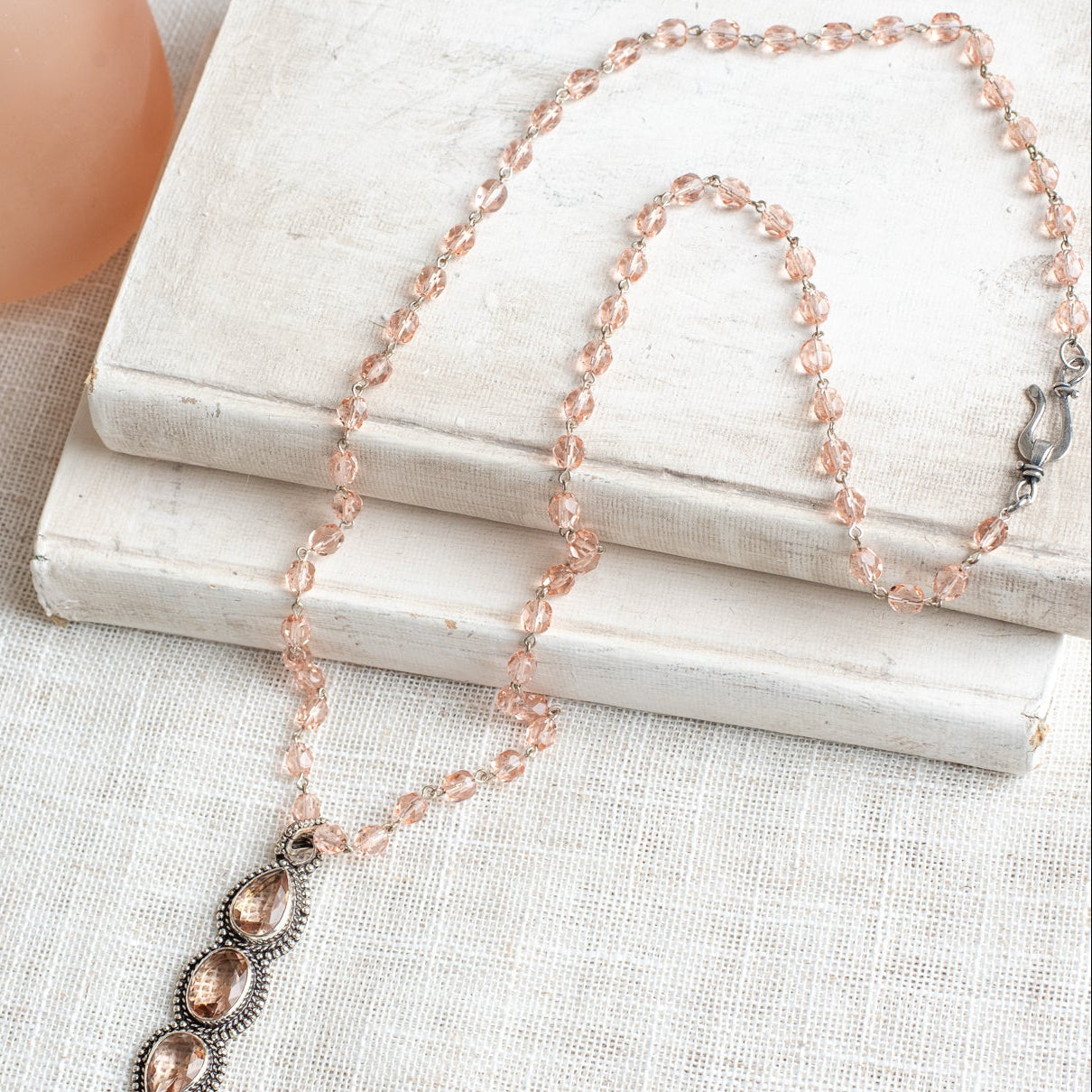 Soft Peach Triple Stone Crystal Silvertone Line Pendant on a Matching Crystal Rosary Chain Necklac