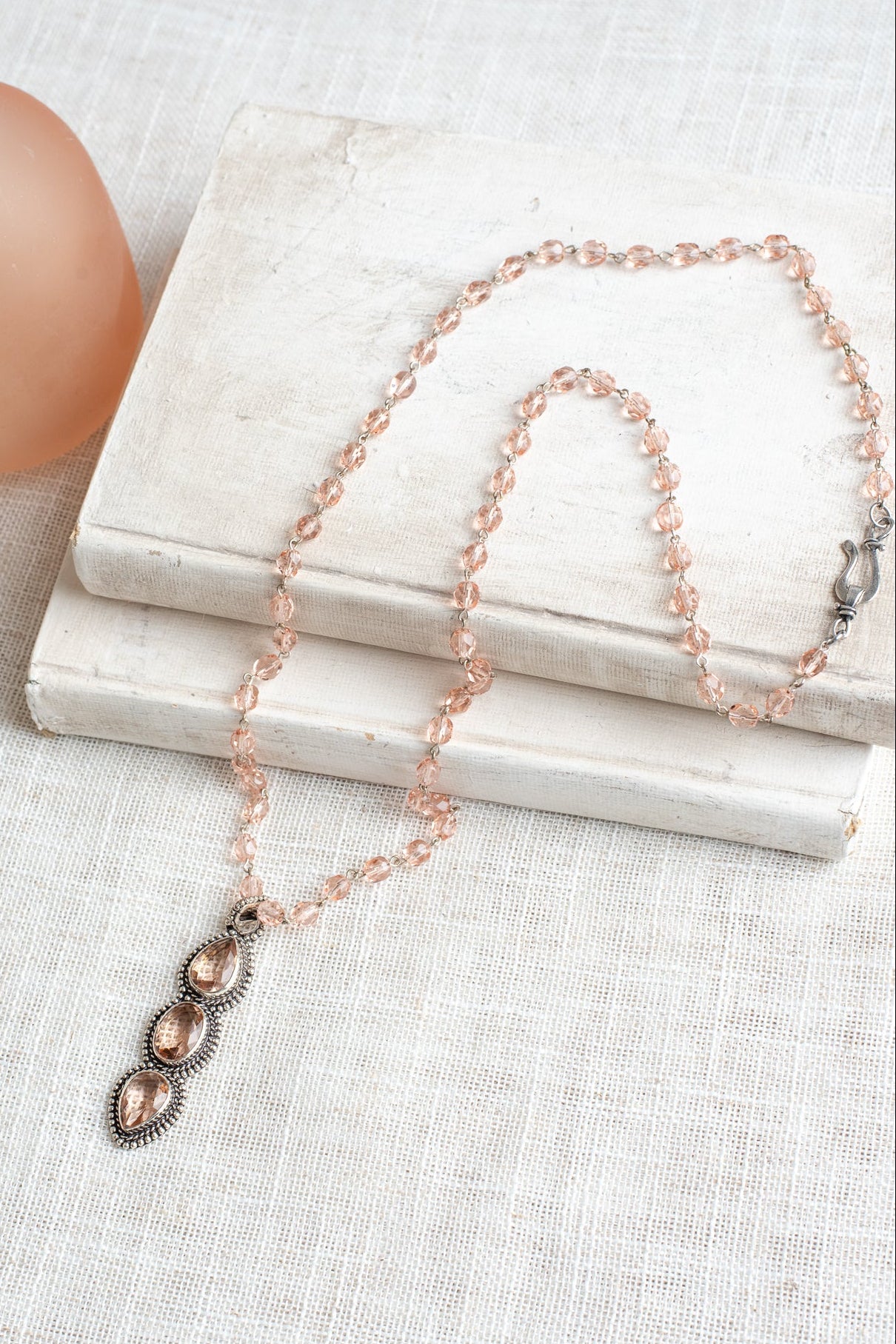 Soft Peach Triple Stone Crystal Silvertone Line Pendant on a Matching Crystal Rosary Chain Necklac