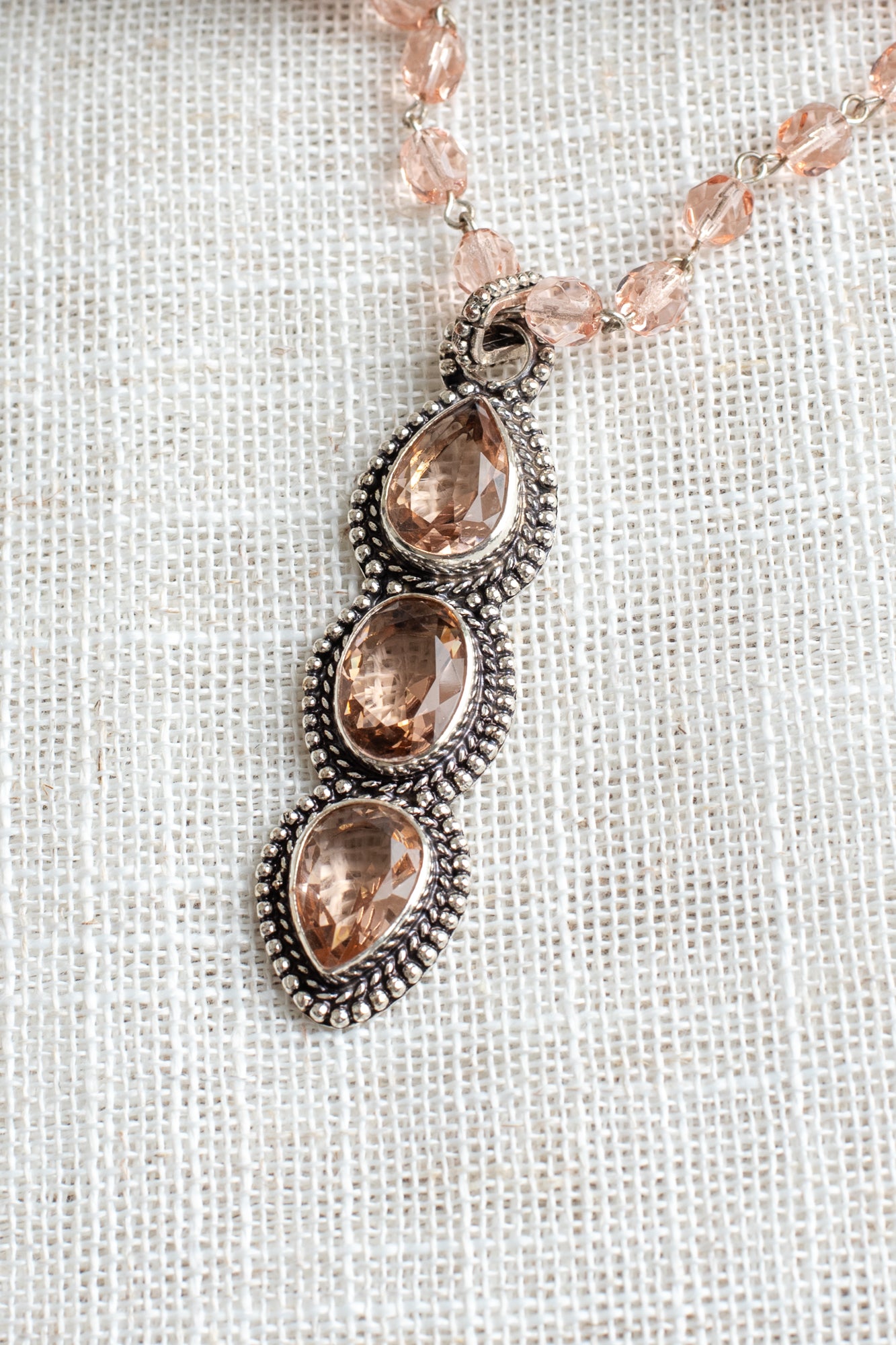 Soft Peach Triple Stone Crystal Silvertone Line Pendant on a Matching Crystal Rosary Chain Necklac