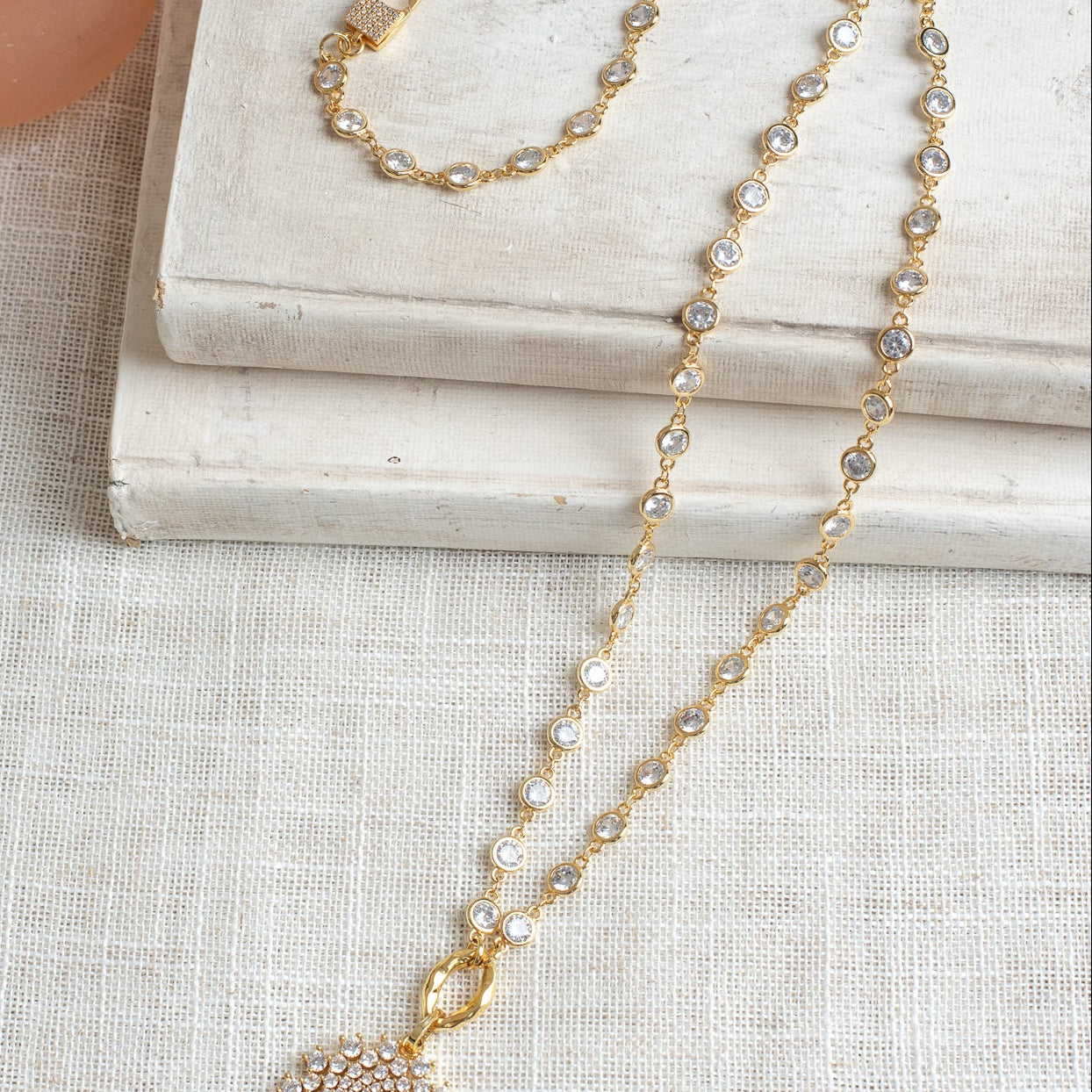 Elegant Gold Plated White Crystal Round Pendant on a Gold Plated Faceted Crystal Station Chain