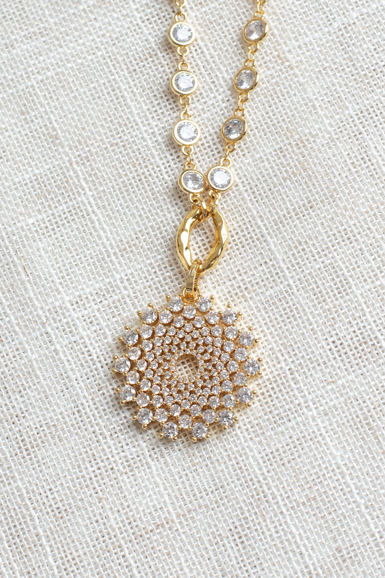 Elegant Gold Plated White Crystal Round Pendant on a Gold Plated Faceted Crystal Station Chain