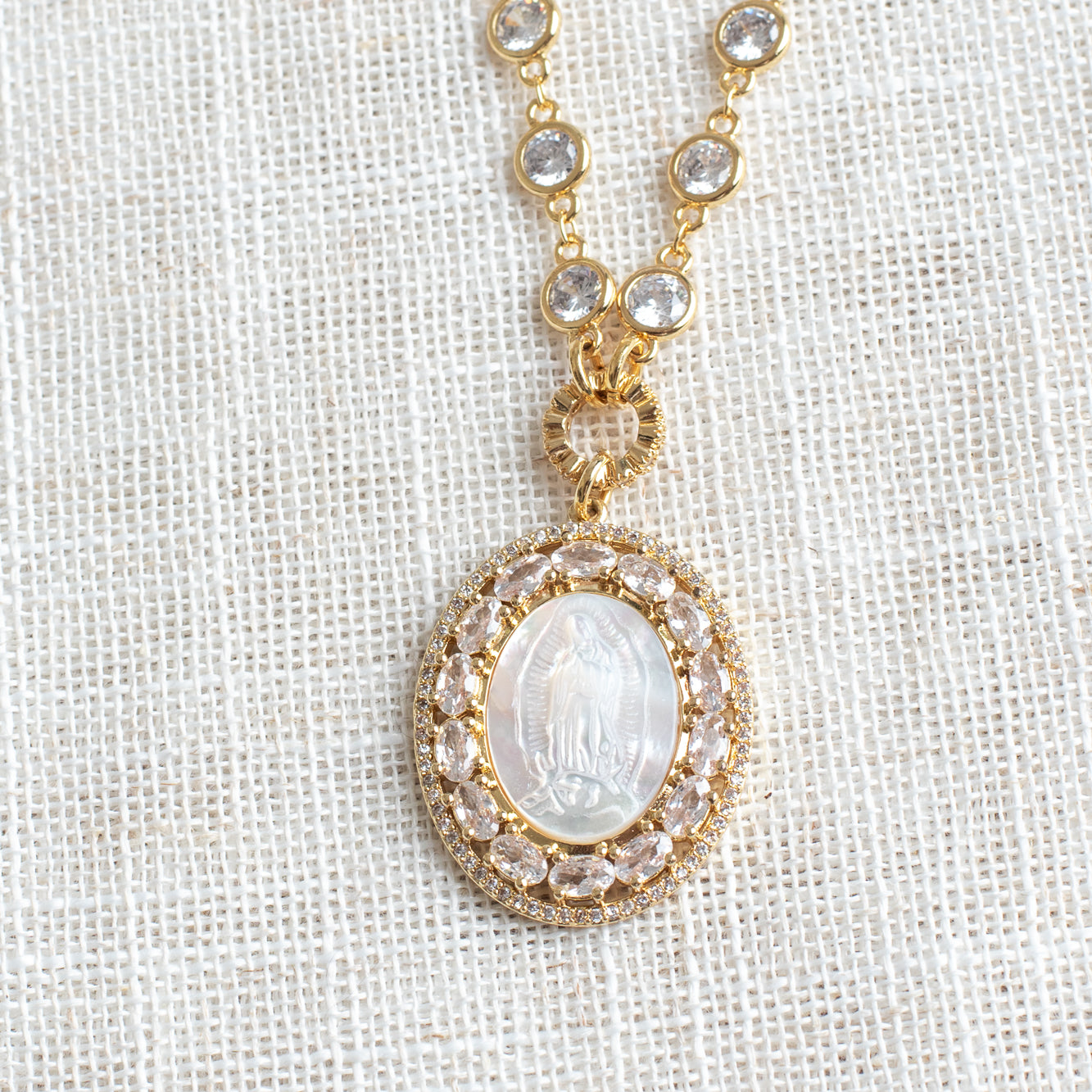Mother of Pearl Catholic Double Halo Pendant on a Gold Clear Crystal Station Necklace