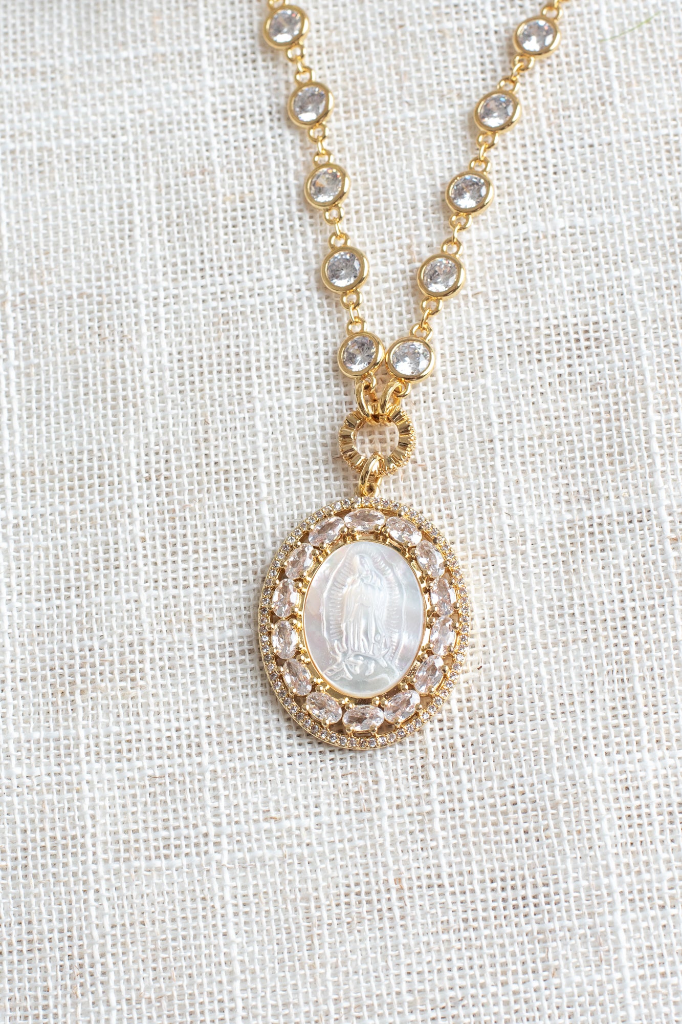 Mother of Pearl Catholic Medal with Crystal Double Halo Pendant on a Gold Plated Clear Crystal Station Chain Necklace