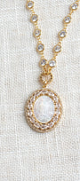 Mother of Pearl Catholic Double Halo Pendant on a Gold Clear Crystal Station Necklace
