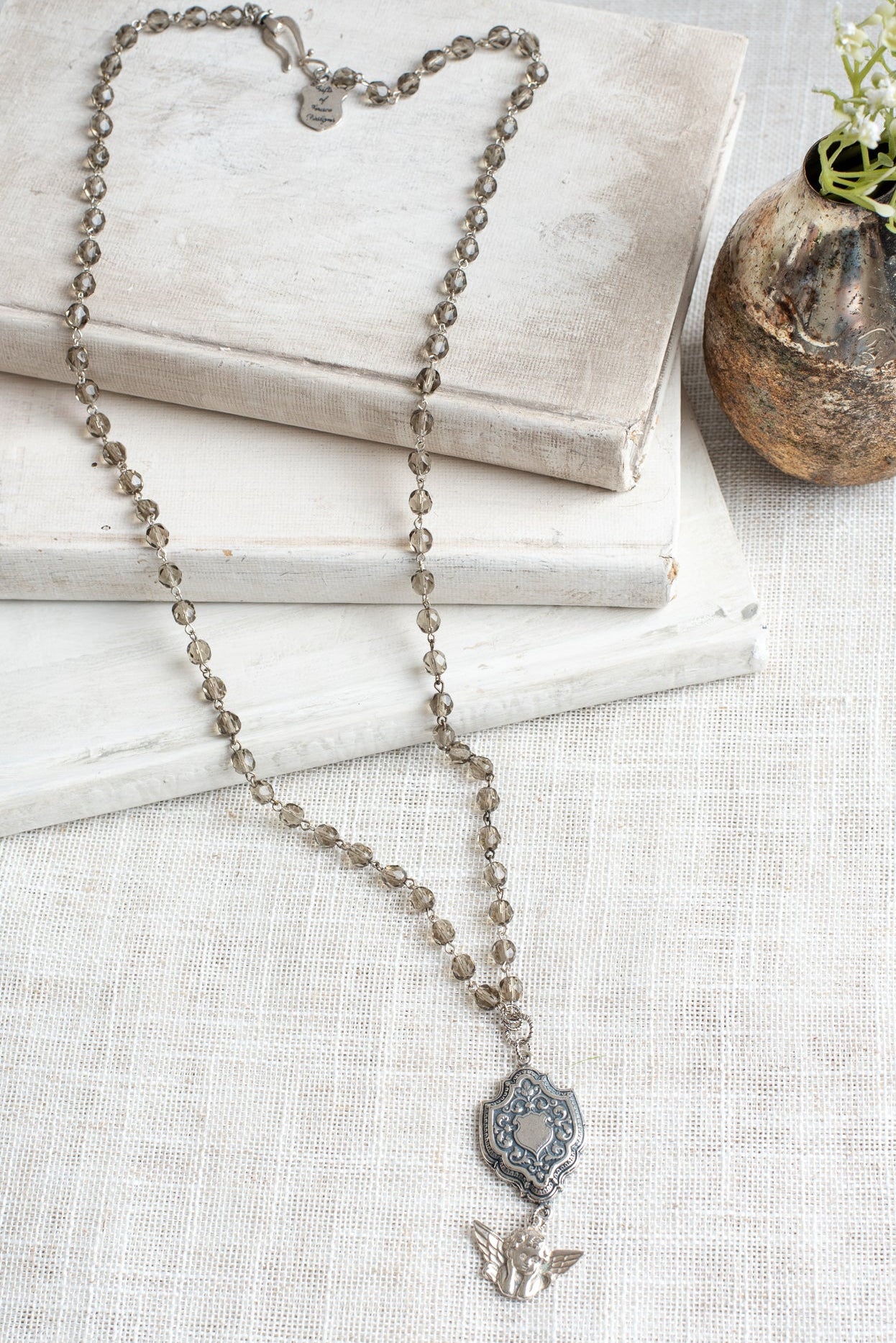 Sterling Silver Cherub and Vintage Style Silver Plated Shield Filigree Pendant on a Taupe Crystal and Silver Rosary Chain Necklace