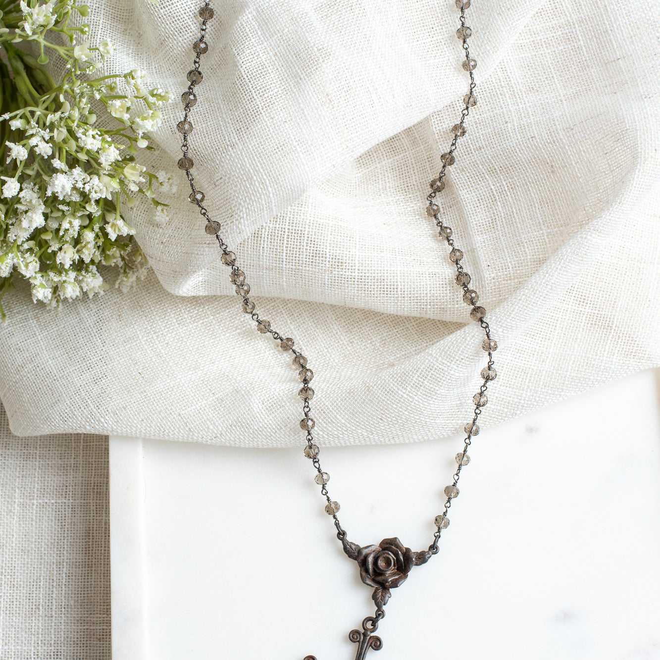 Dark Bronze Cross Pendant on Smoky Quartz and Gunmetal Rosary Chain