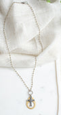Gold and Silver Cutout Cross Pendant Necklace on Mixed Metal Rosary Chain