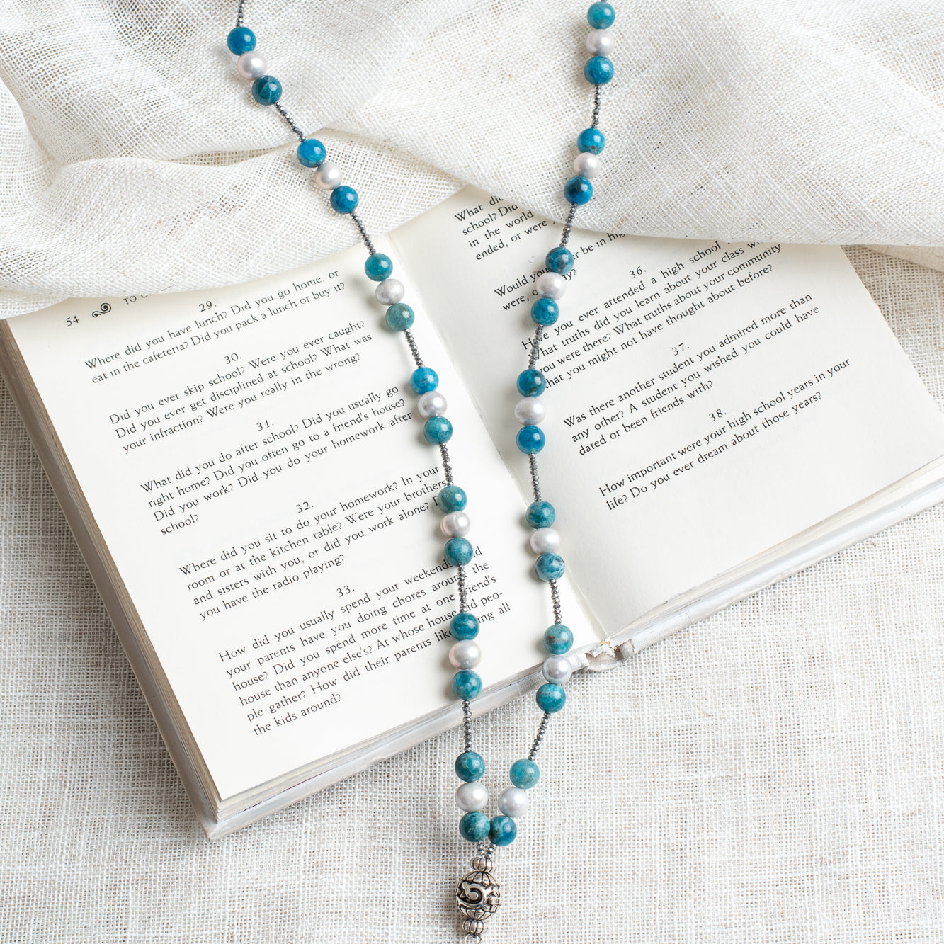 Glowing Sterling Silver Blue Labradorite Pendant on a Hand Strung Strand of Apatite, Pearls, and Hemitite Beaded Necklace