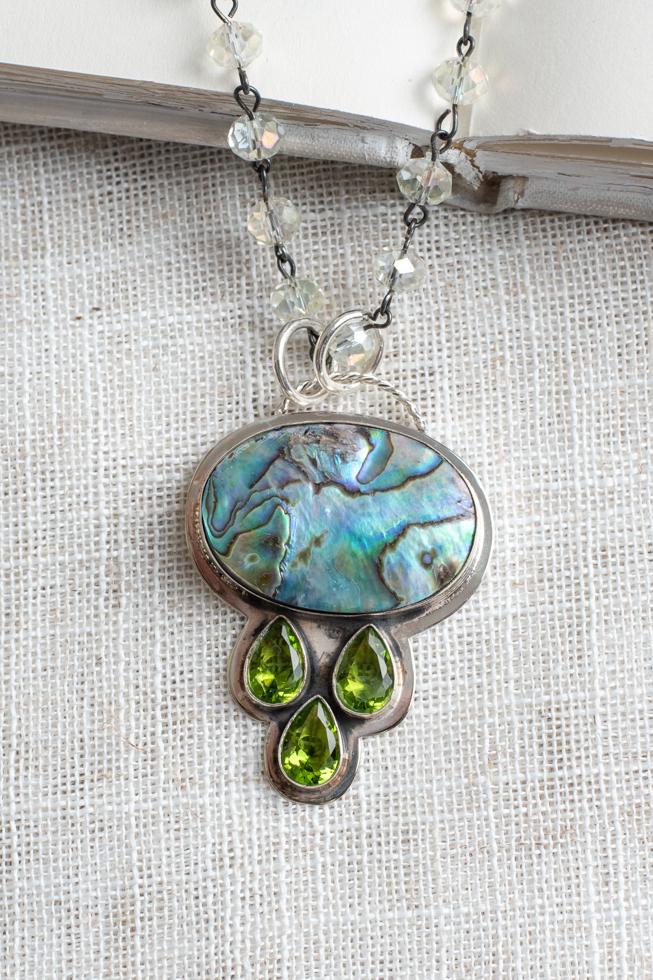 Sterling Silver Multicolor Abalone Pendant with 3 Tear Drop Peridot on a Clear Crysal Rosary Chain