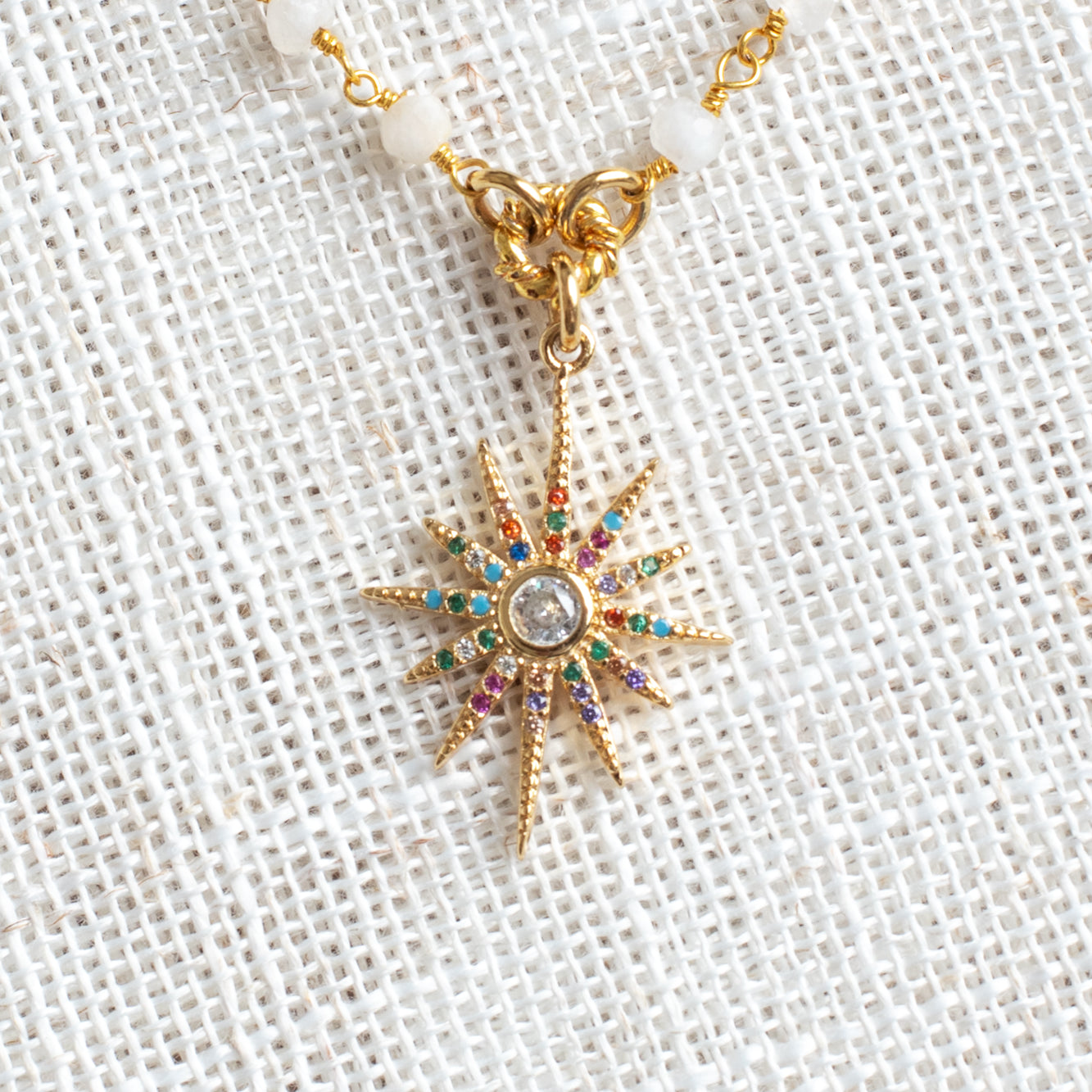 Starburst Pendant on a Moonstone and Gold Rosary Chain Necklace