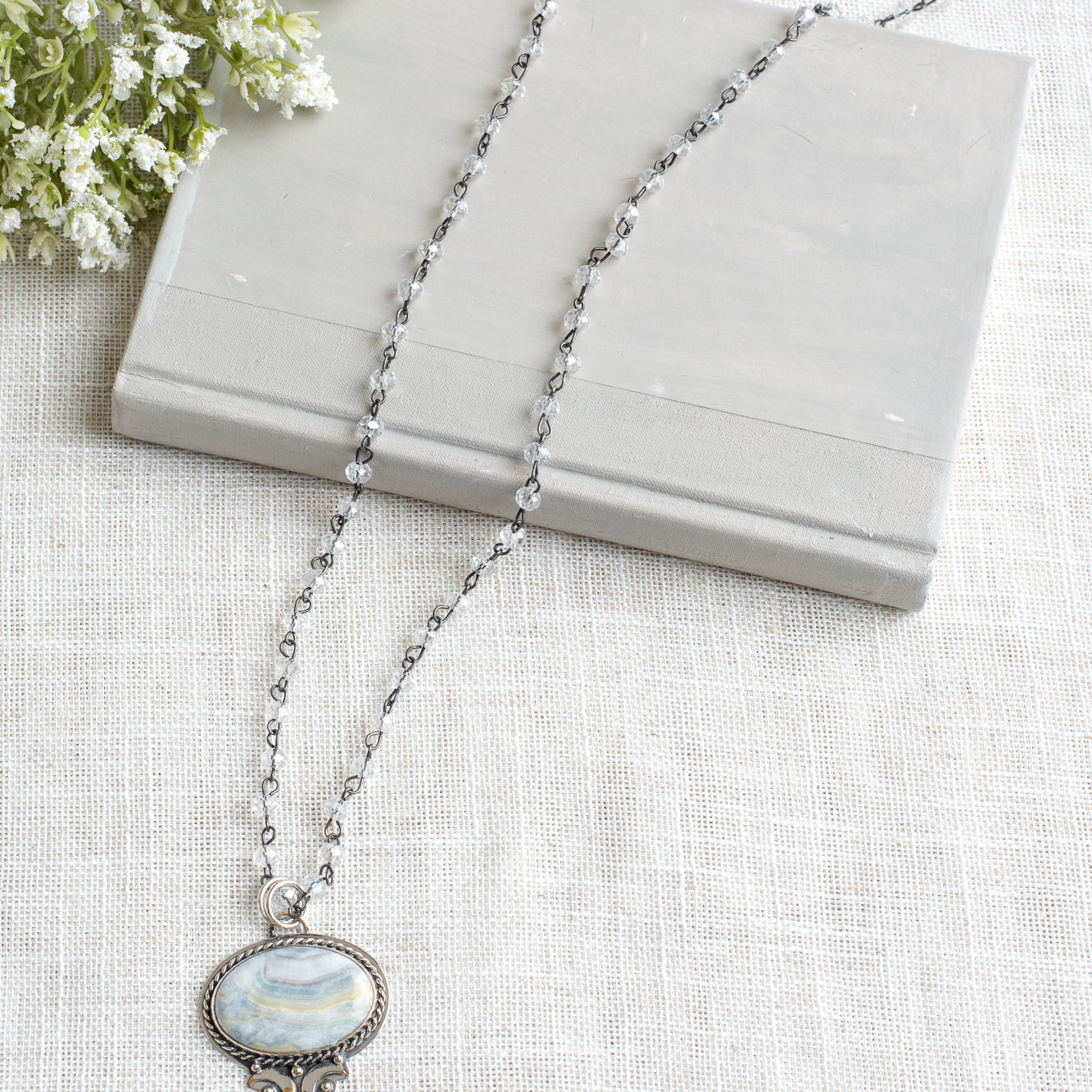 Sterling Silver Gray Opal Stone Pendant with a Feather Charm on a Gray Crystal Gunmetal Rosary Chain Necklace