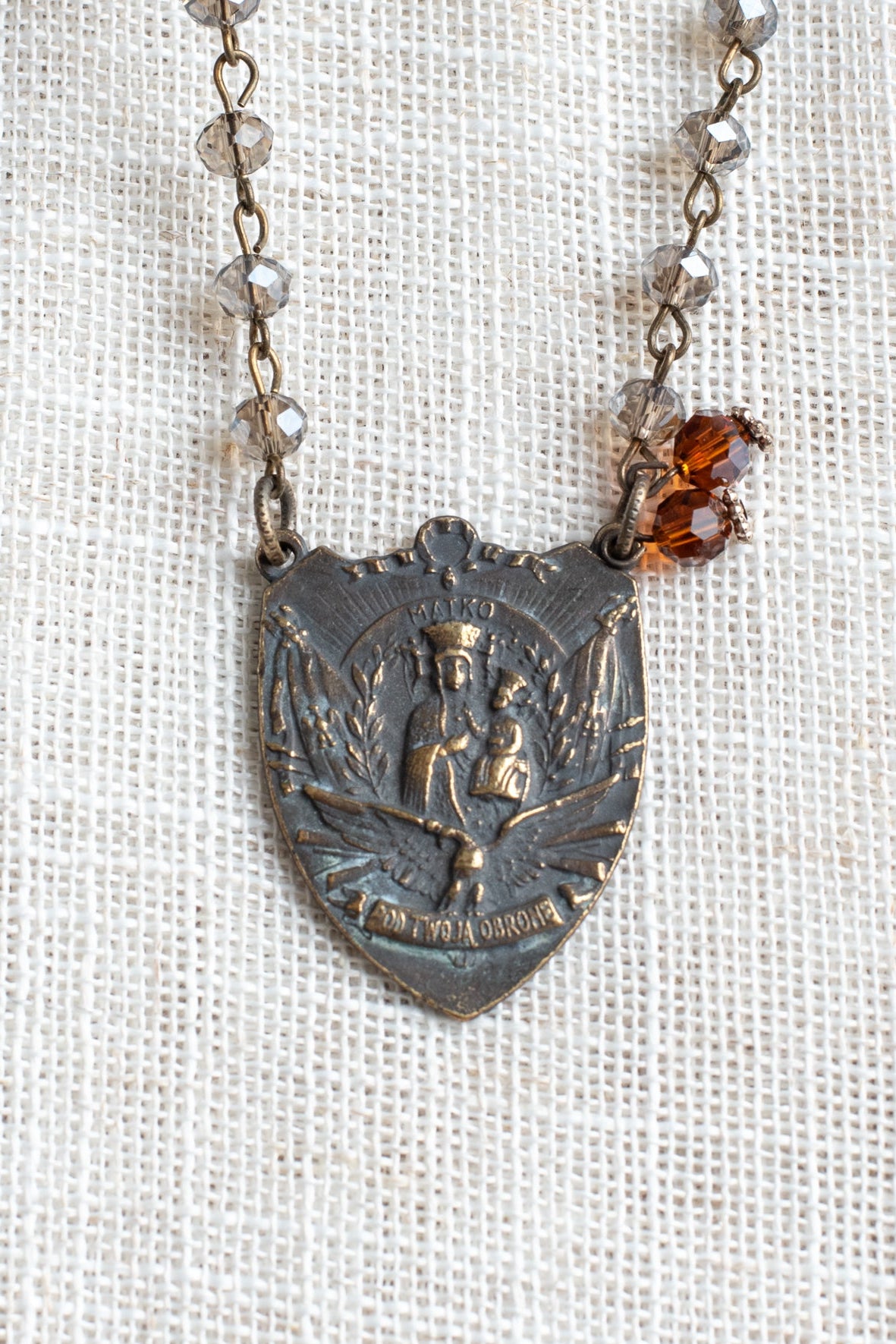 Prague Madonna and Child Catholic Bronze Shield Pendant on a Gray Crystal Rosary Chain Necklace