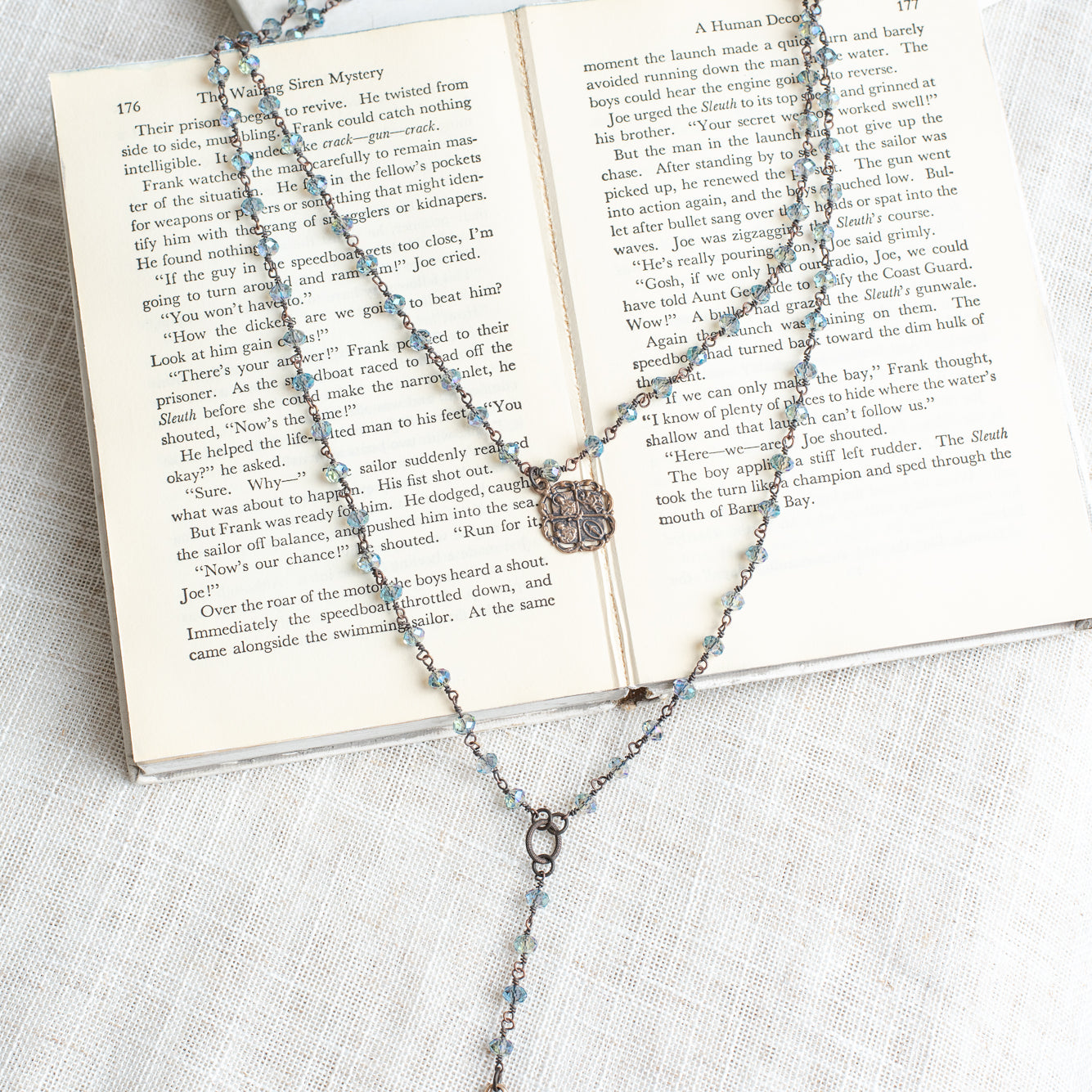 Double Layer Ornate Bronze Heart Pendant with Iridescent Blue Crystal Beads and Catholic Medal Necklace