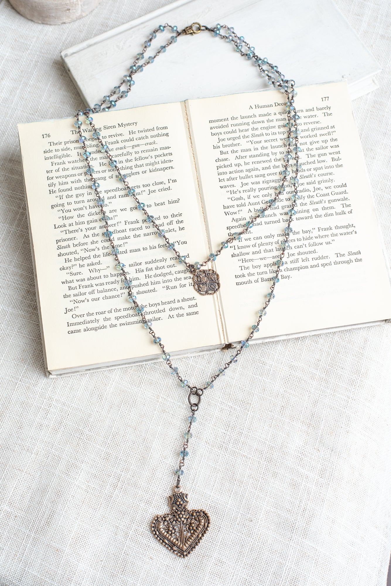 Double Layer Ornate Bronze Heart Pendant with Iridescent Blue Crystal Beads and Catholic Medal Necklace