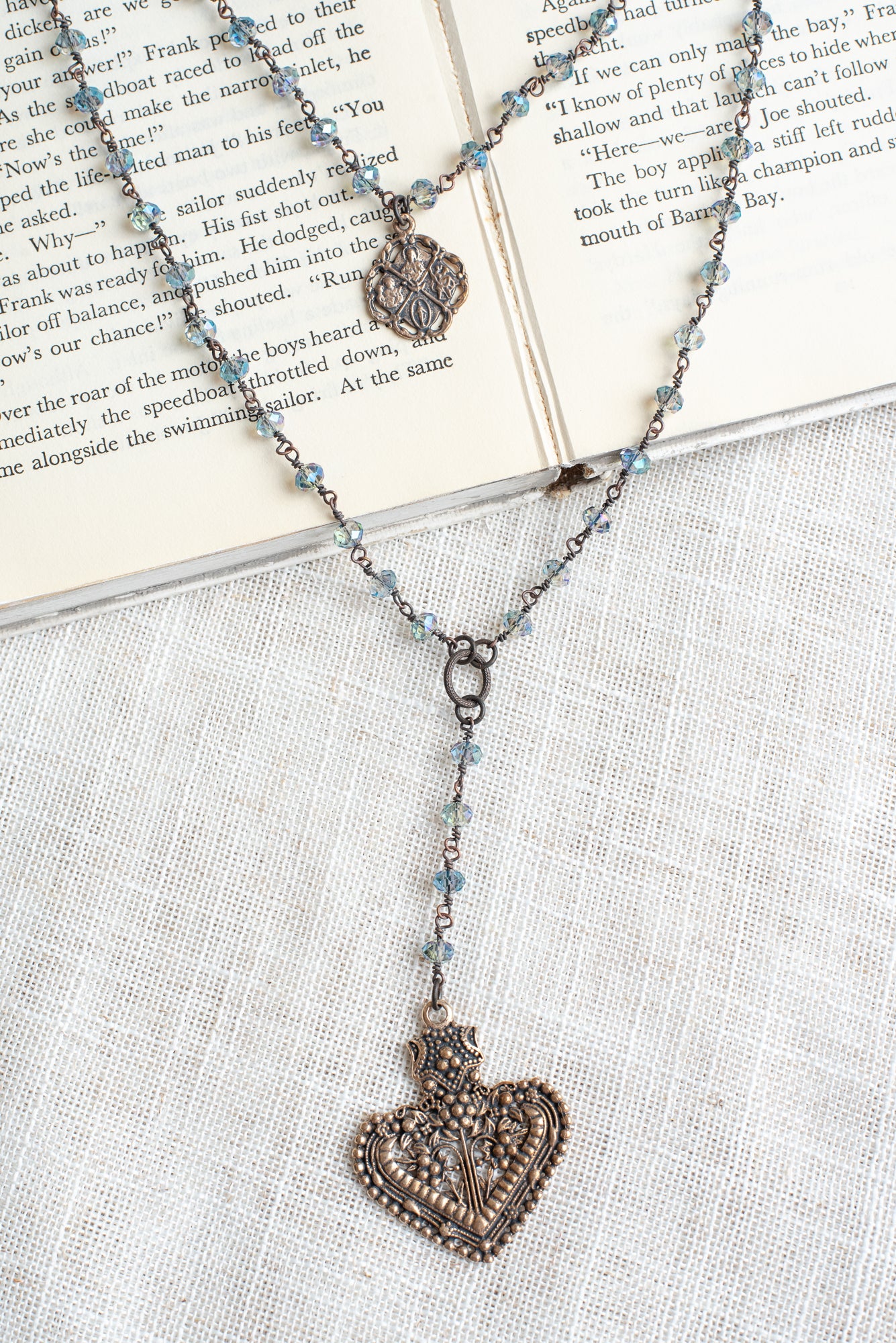 Double Layer Ornate Bronze Heart Pendant with Iridescent Blue Crystal Beads and Catholic Medal Necklace