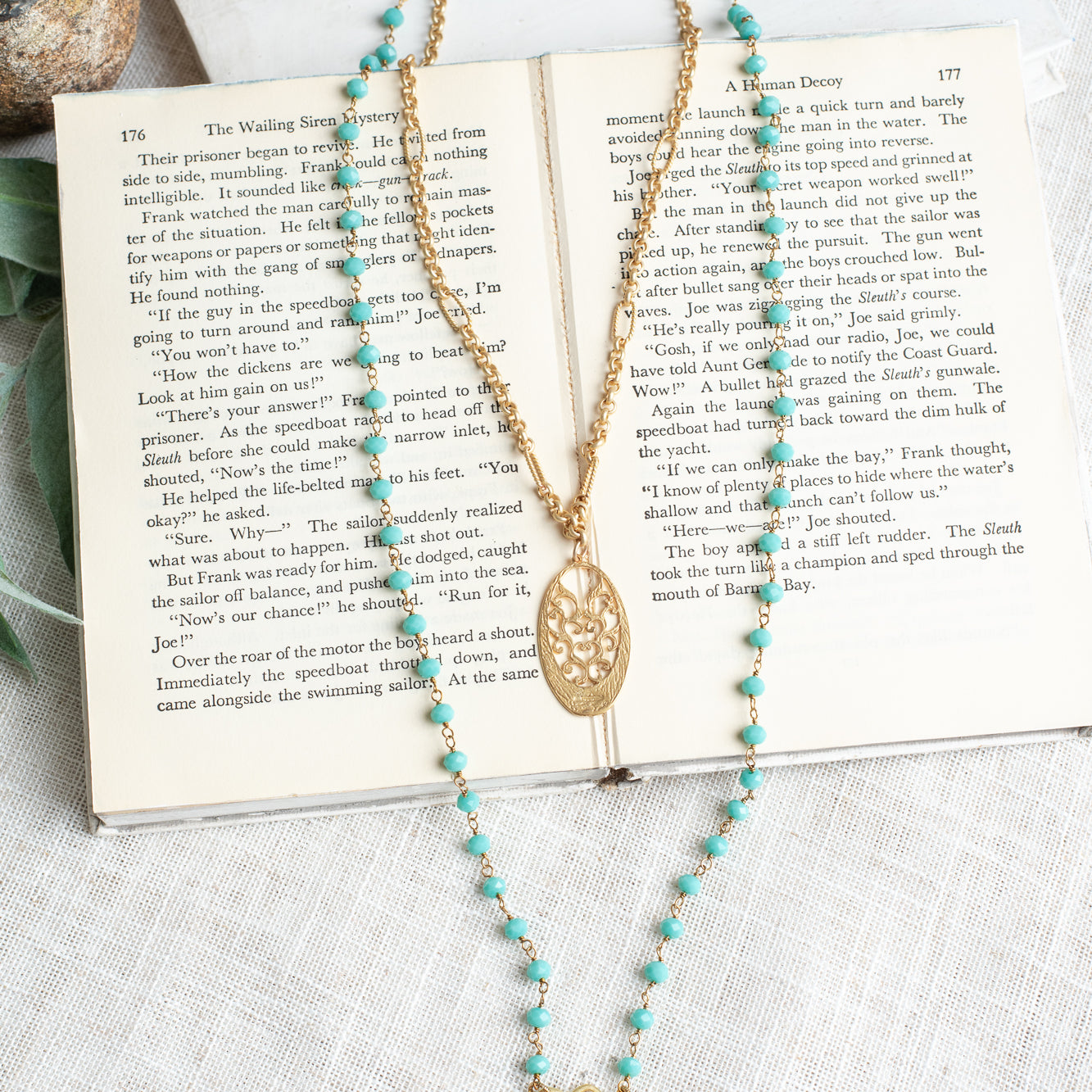 Matte Gold Filigree Pendant on a Double Layer Necklace with Turquoise Crystal Beaded Rosary Chain