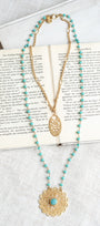 Matte Gold Filigree Pendant on a Double Layer Necklace with Turquoise Crystal Beaded Rosary Chain