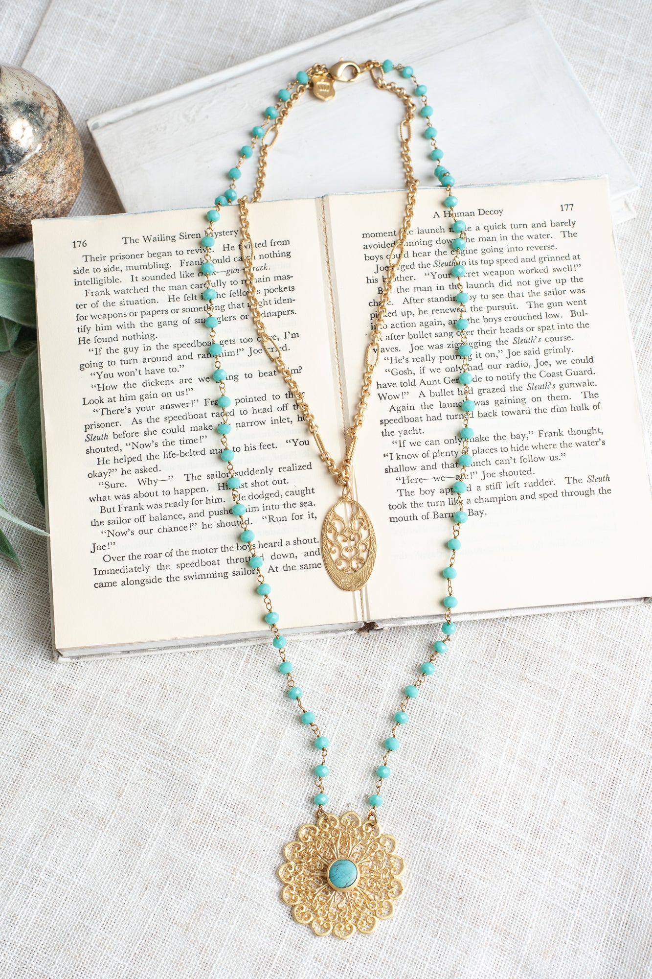Matte Gold Filigree Pendant on a Double Layer Necklace with Turquoise Crystal Beaded Rosary Chain