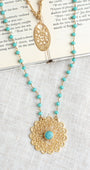 Matte Gold Filigree Pendant on a Double Layer Necklace with Turquoise Crystal Beaded Rosary Chain