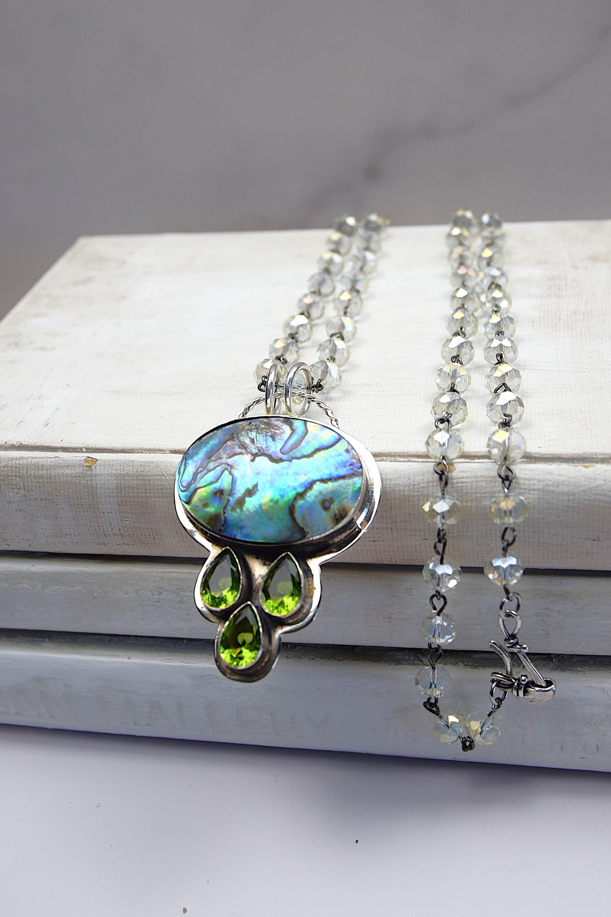 Sterling Silver Multicolor Abalone Pendant with 3 Tear Drop Peridot on a Clear Crysal Rosary Chain