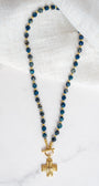 Gold Cross Pendant on a Blue Cat's Eye Stone Beaded Necklace