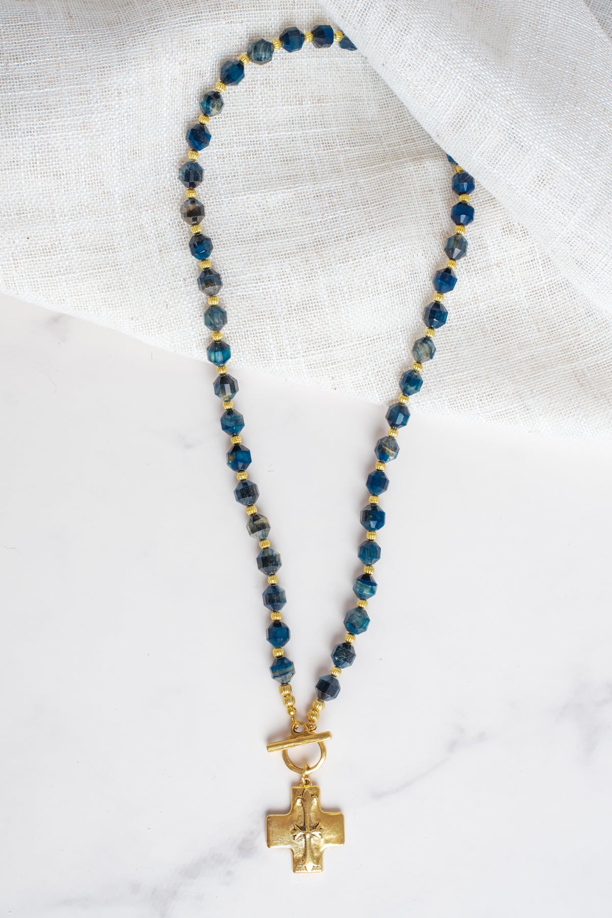 Gold Cross Pendant on a Blue Cat's Eye Stone Beaded Necklace