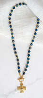 Gold Cross Pendant on a Blue Cat's Eye Stone Beaded Necklace