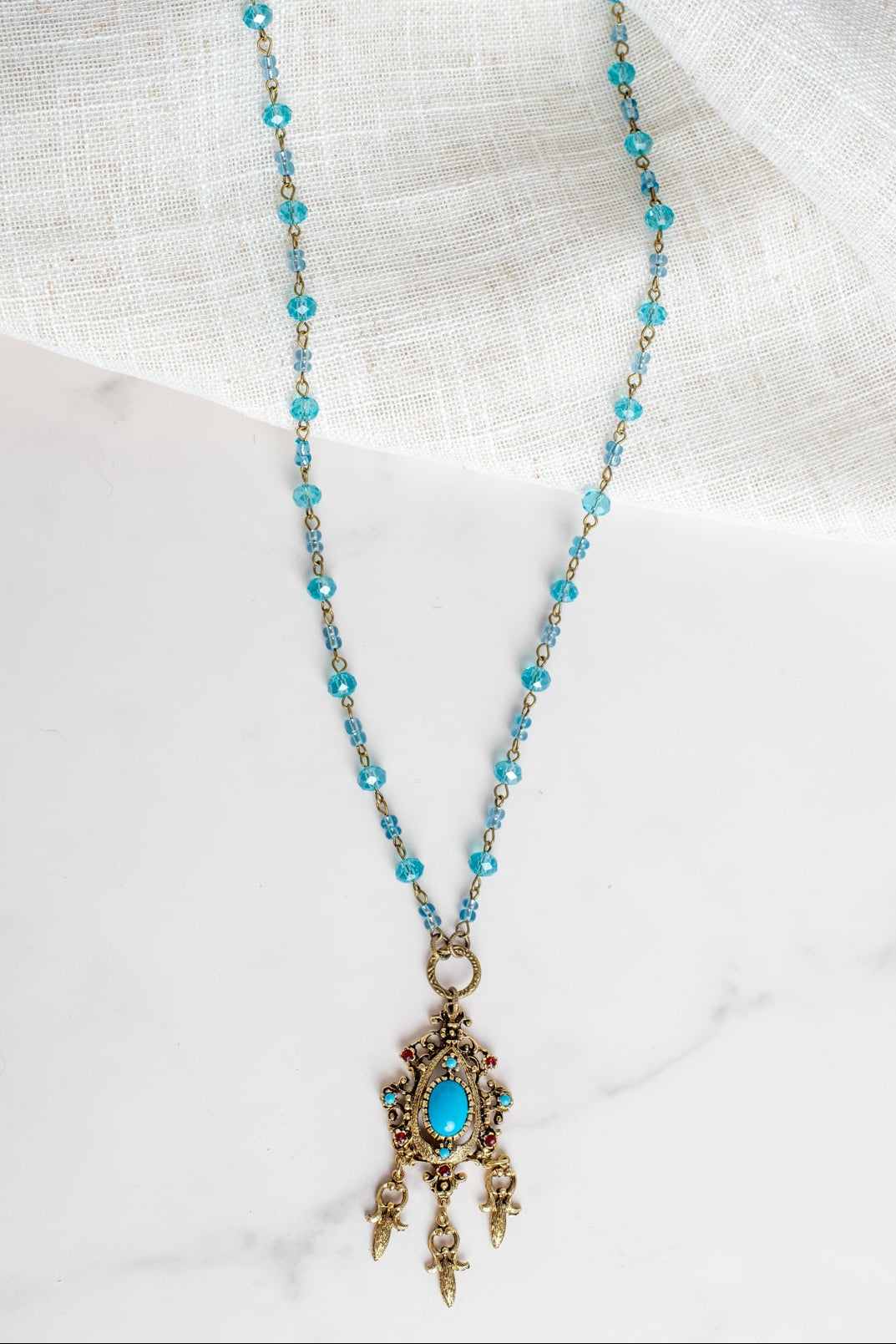Vintage Dark Gold Designer Pendant with Red Rhinestones and Faux Turquoise on a Turquoise Crystal and Gold Rosary Chain Necklace