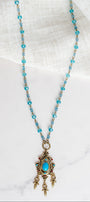 Vintage Dark Gold Designer Pendant with Red Rhinestones and Faux Turquoise on a Turquoise Crystal and Gold Rosary Chain Necklace
