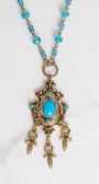 Vintage Dark Gold Designer Pendant with Red Rhinestones and Faux Turquoise on a Turquoise Crystal and Gold Rosary Chain Necklace