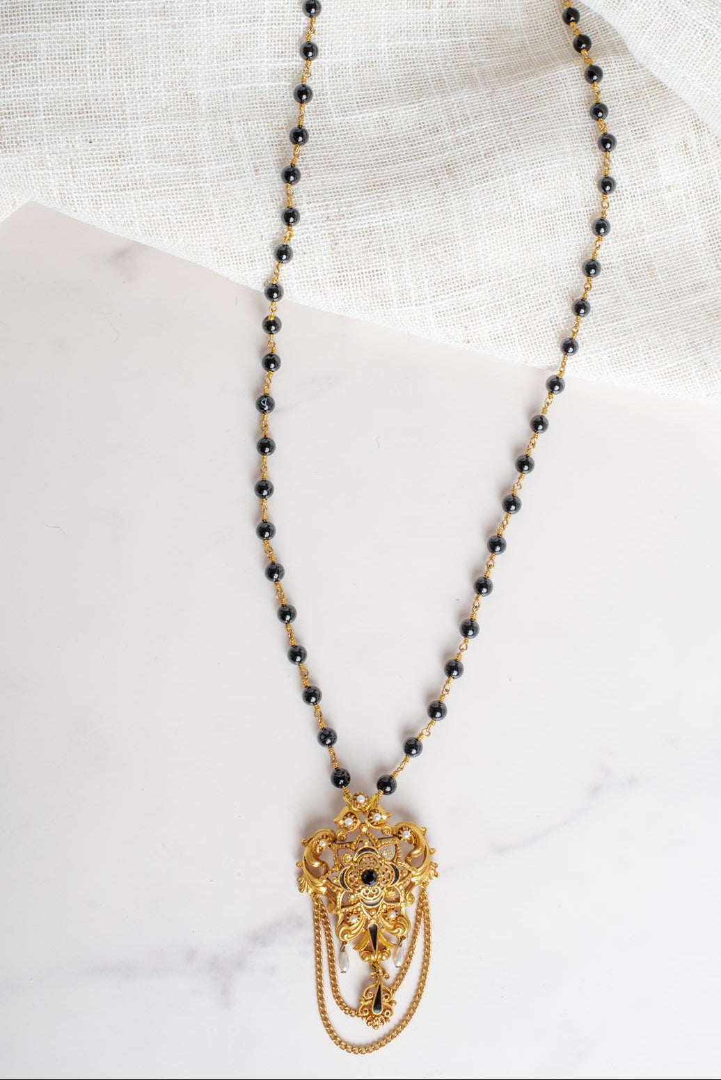 Vintage Gold Plated Florenza Collectible Brooch Pendant with Black Rhinestones, Faux Pearls, Black Enamel and Chain Draping on a Black Stone Rosary Chain Necklace