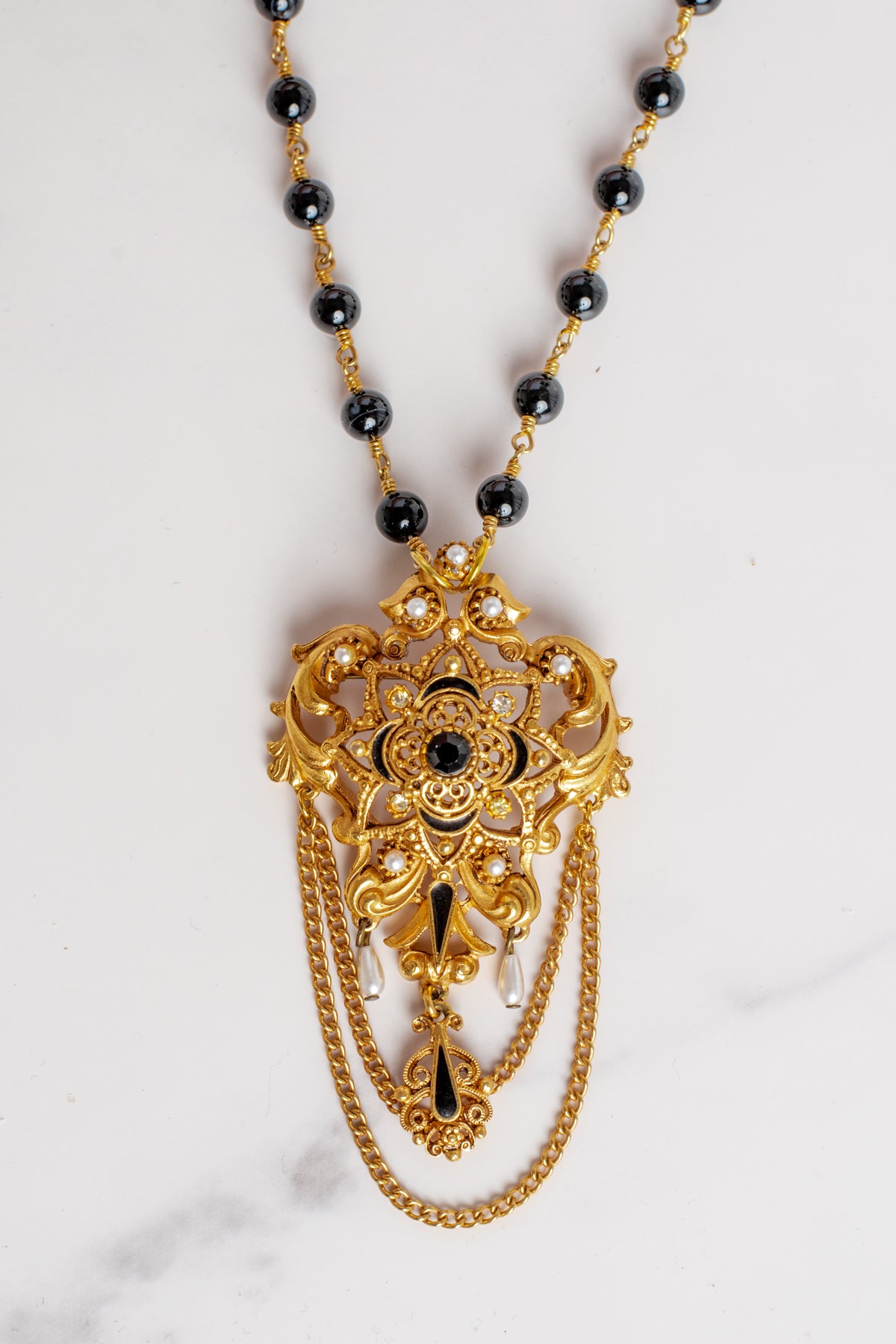 Vintage Gold Plated Florenza Collectible Brooch Pendant with Black Rhinestones, Faux Pearls, Black Enamel and Chain Draping on a Black Stone Rosary Chain Necklace