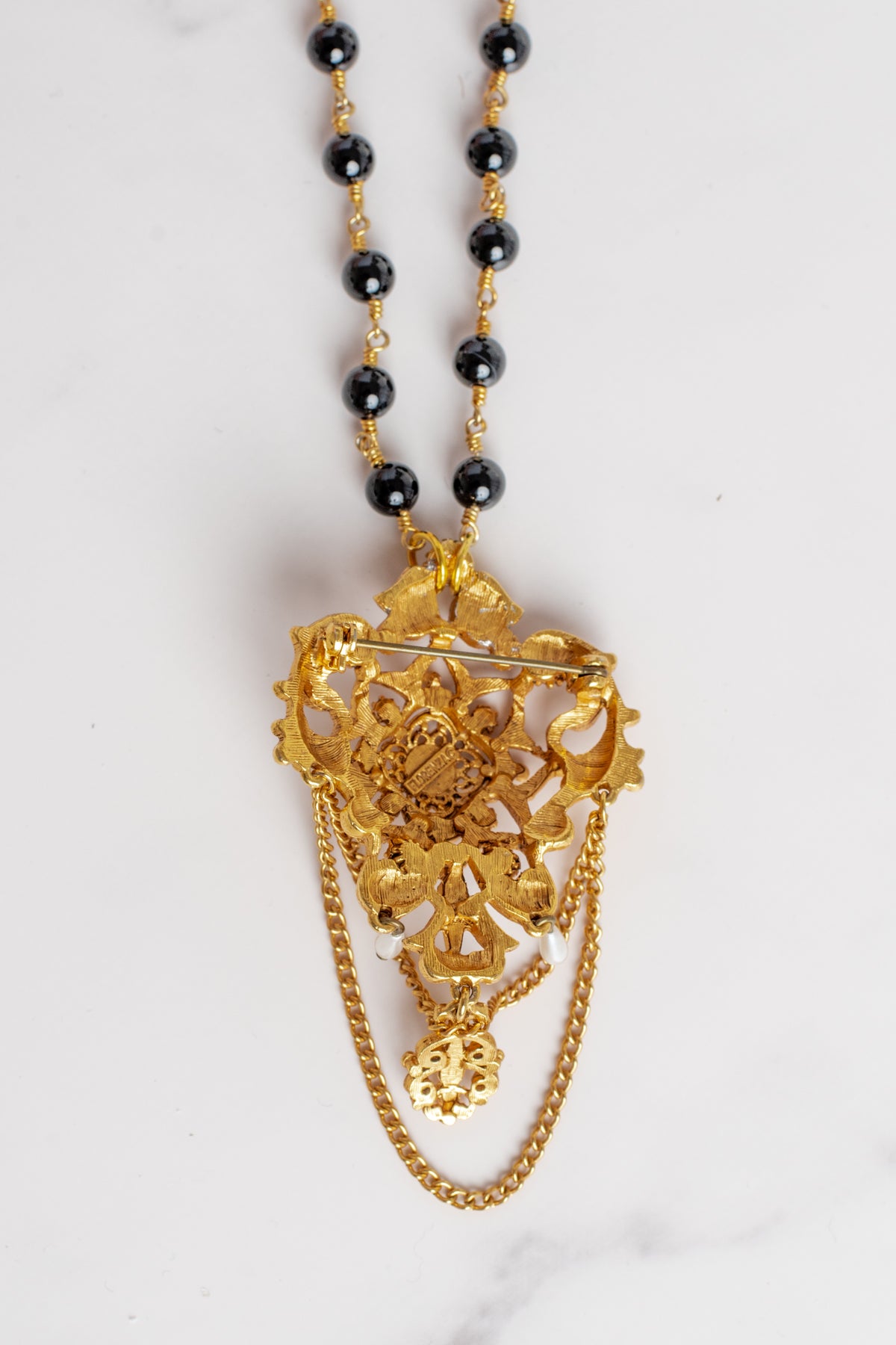 Vintage Gold Plated Florenza Collectible Brooch Pendant with Black Rhinestones, Faux Pearls, Black Enamel and Chain Draping on a Black Stone Rosary Chain Necklace