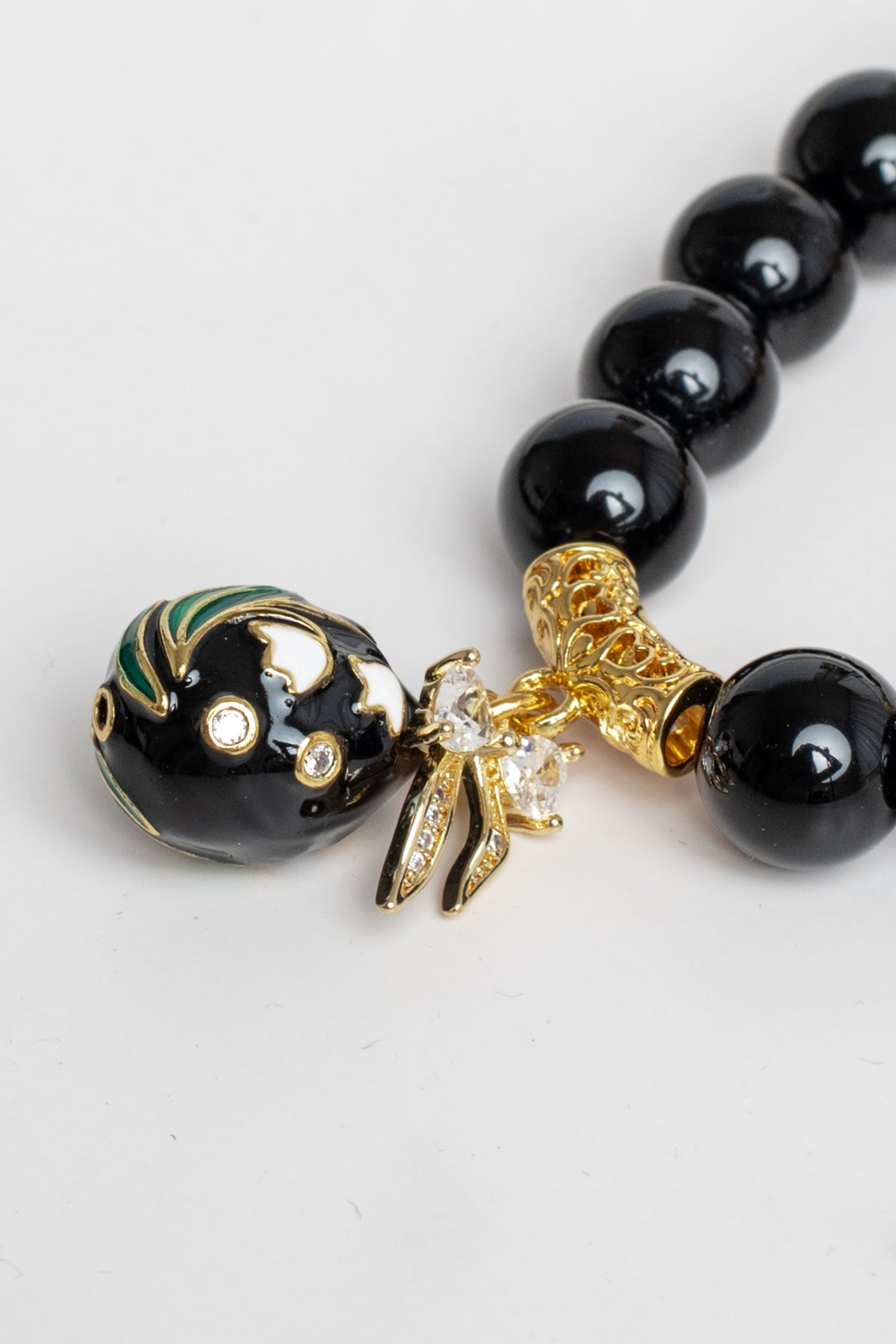 Black Onyx Stone and Gold Bead Stretch Bracelet with Cloisonne Charm and Crystal Bow