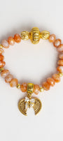 Gold Italian Style Focal Beads on a Stretch Bracelet of Orange White Agate with Wings and Heart Charm