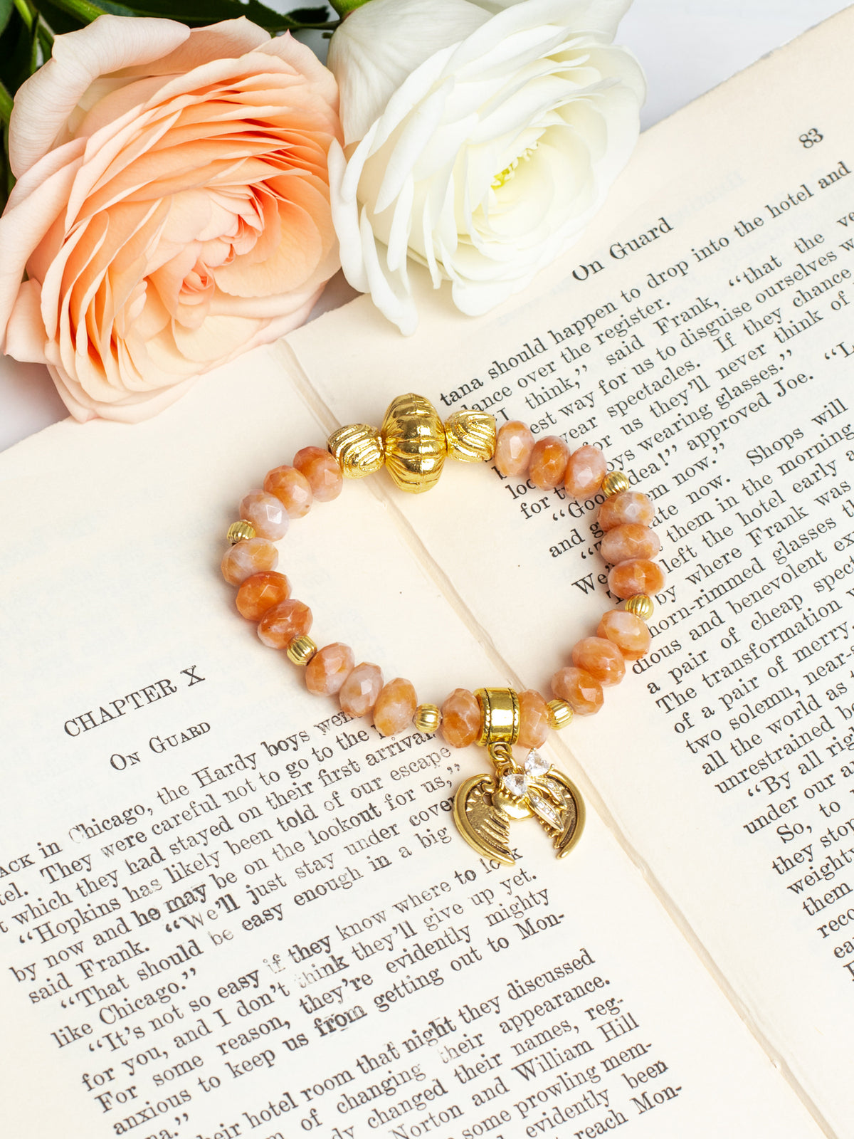 Gold Italian Style Focal Beads on a Stretch Bracelet of Orange White Agate with Wings and Heart Charm