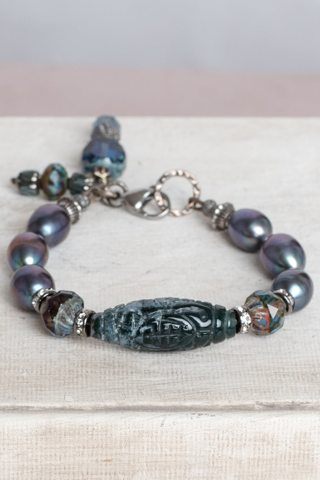 Peacock Pearl Bracelet with Carved Stone Focal and Czech Crystal Beads and Charms