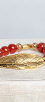 Gold Large Leave Wrist Charm on a Stretch Bracelet of Carnelian Stone Beads