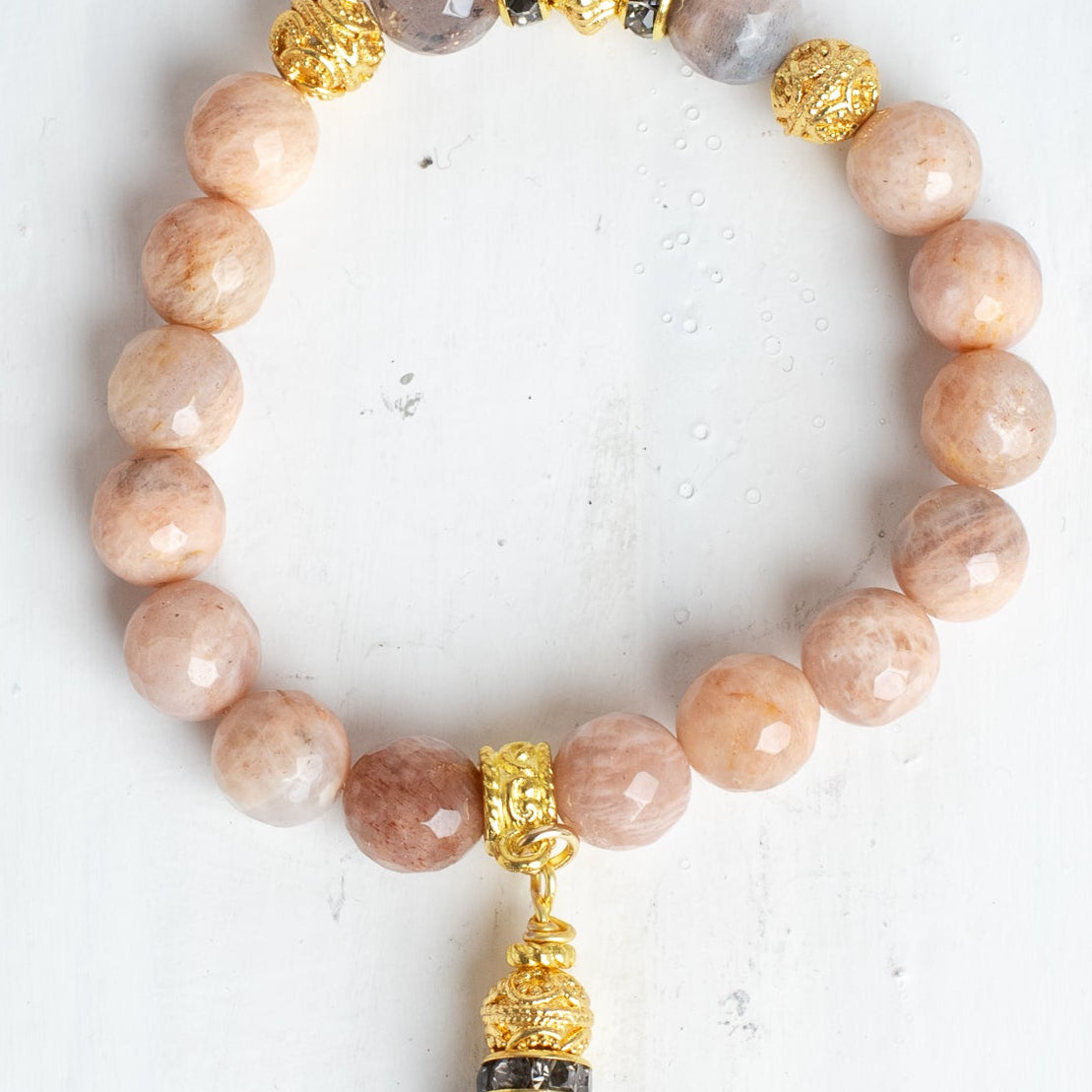 Gold Italian Style Beads and Stone Charm on a Stretch Bracelet of Faceted Peach Moonstone