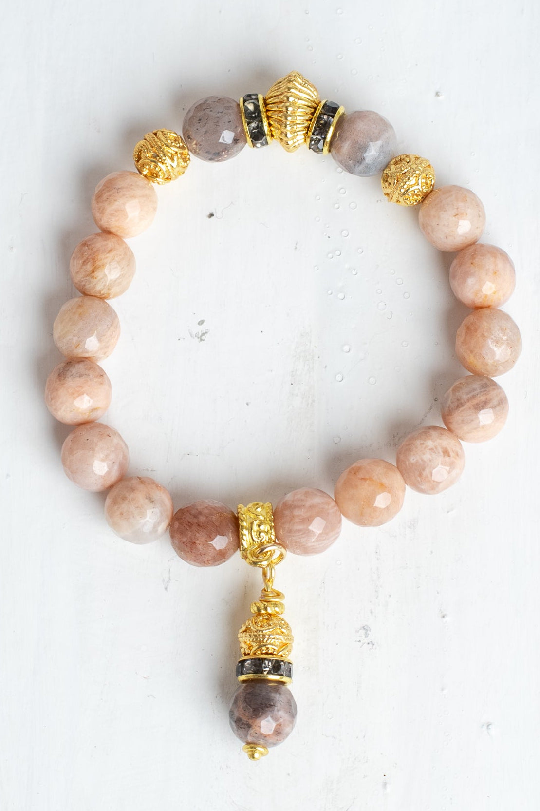 Gold Italian Style Beads and Stone Charm on a Stretch Bracelet of Faceted Peach Moonstone
