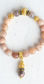 Gold Italian Style Beads and Stone Charm on a Stretch Bracelet of Faceted Peach Moonstone